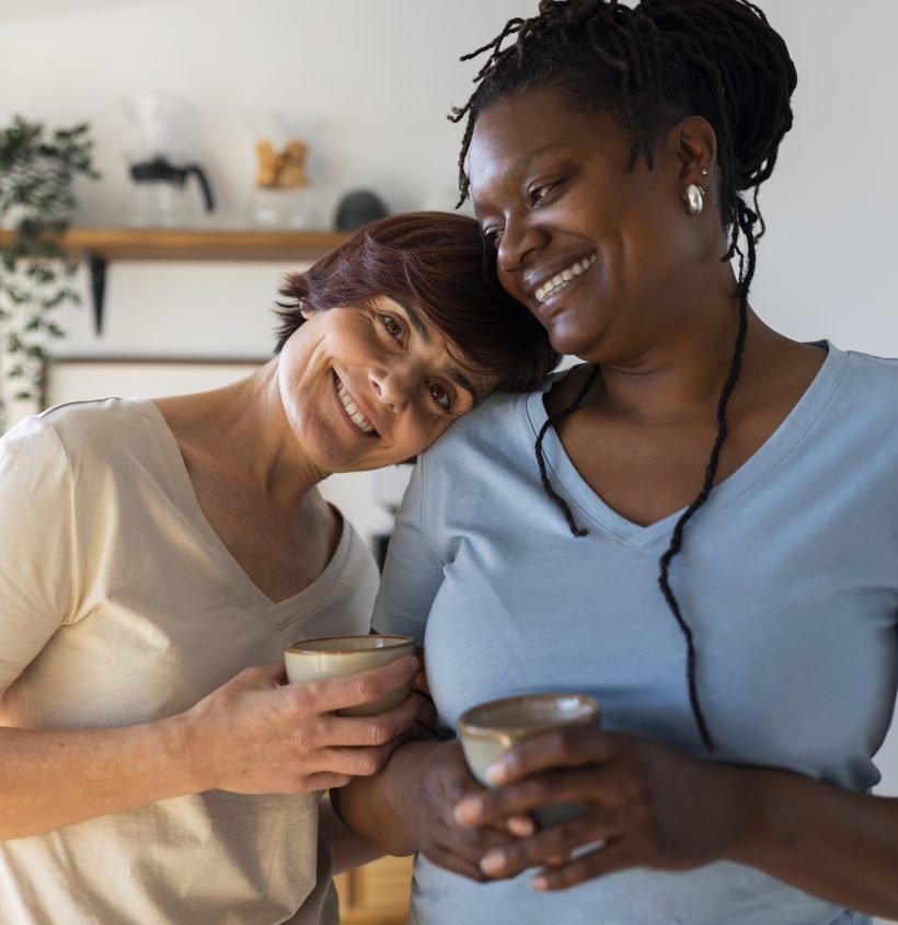 front-view-lesbian-couple-with-coffee-cups